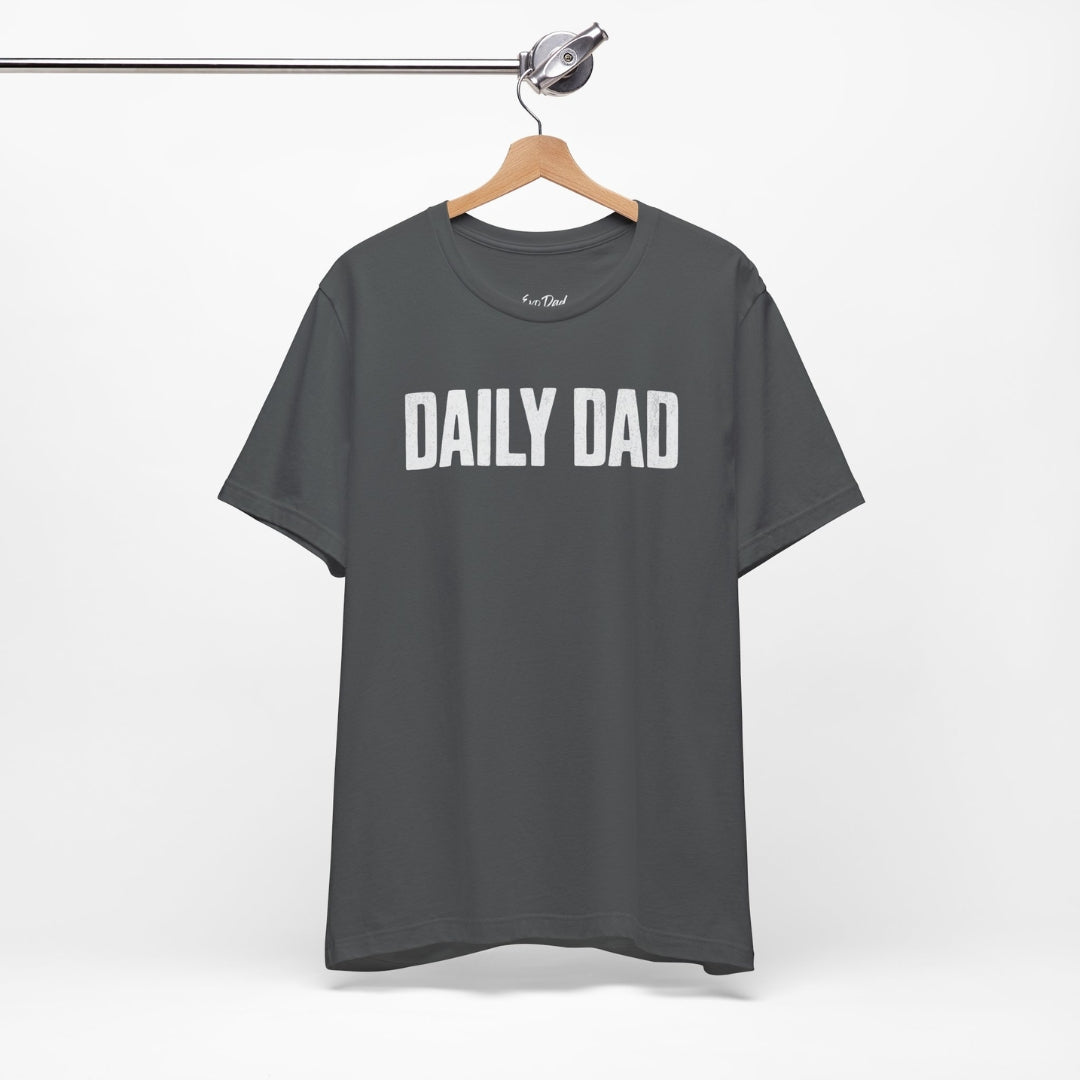 Daily Dad Tee in Charcoal hanging on a hanger — EvoDad Co.